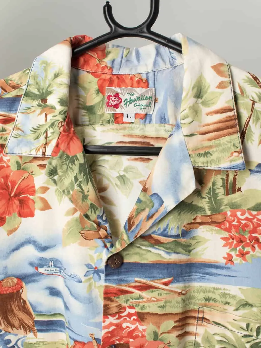 Vintage Hilo Hattie Hawaiian shirt with island scene including female figure – Medium / Large